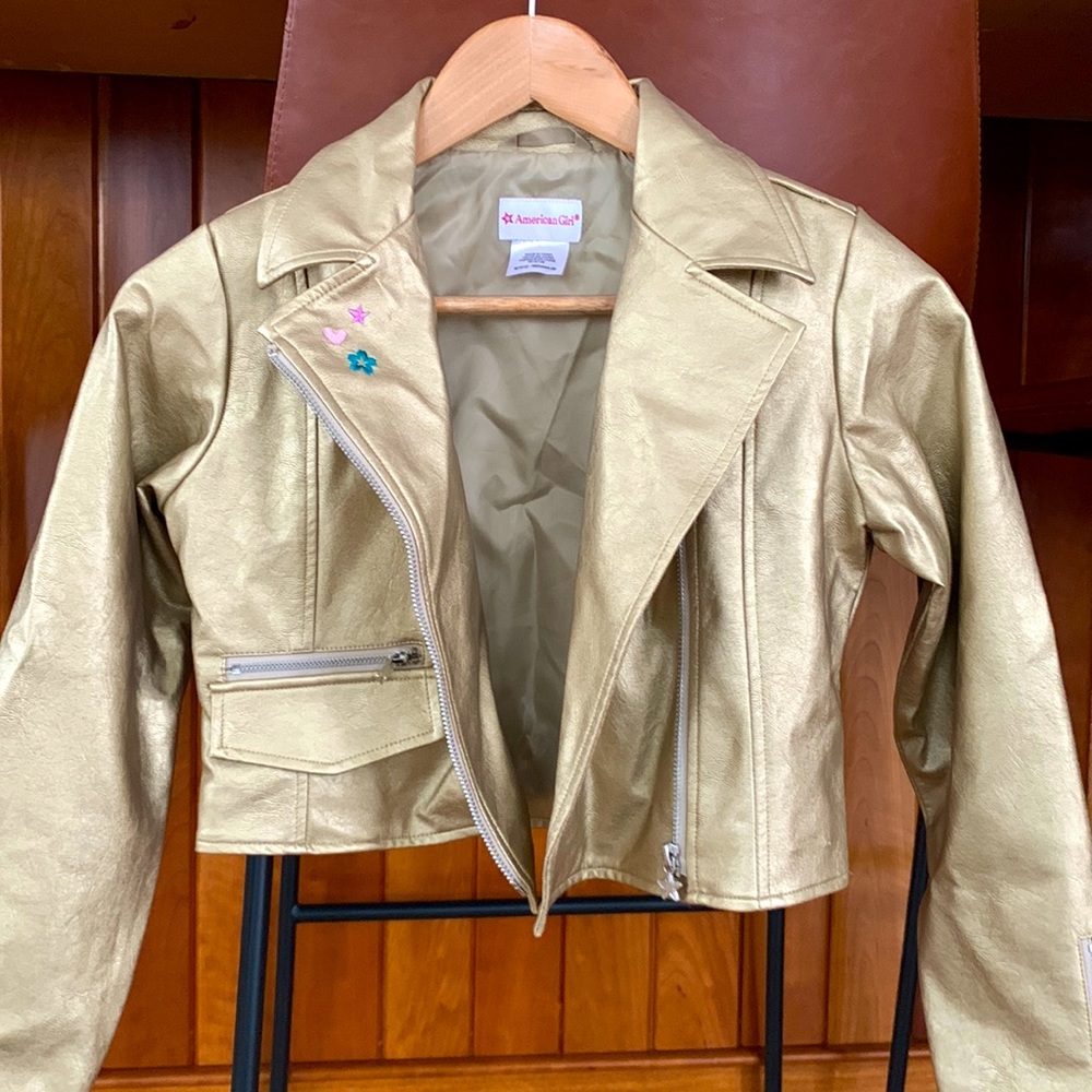 Girls cropped, asymmetrical faux leather jacket.